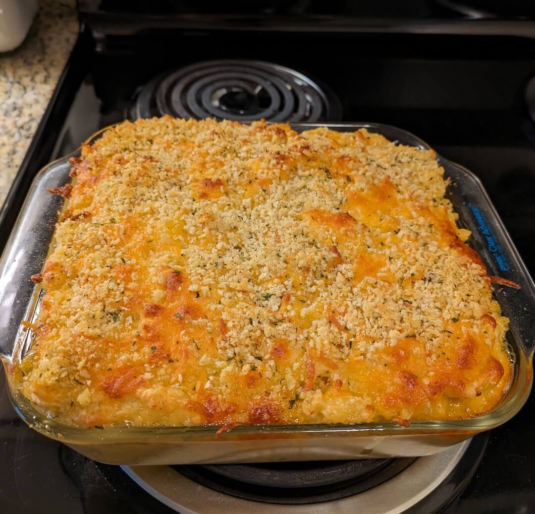 Mac and cheese with bread crumb topping in glass pan